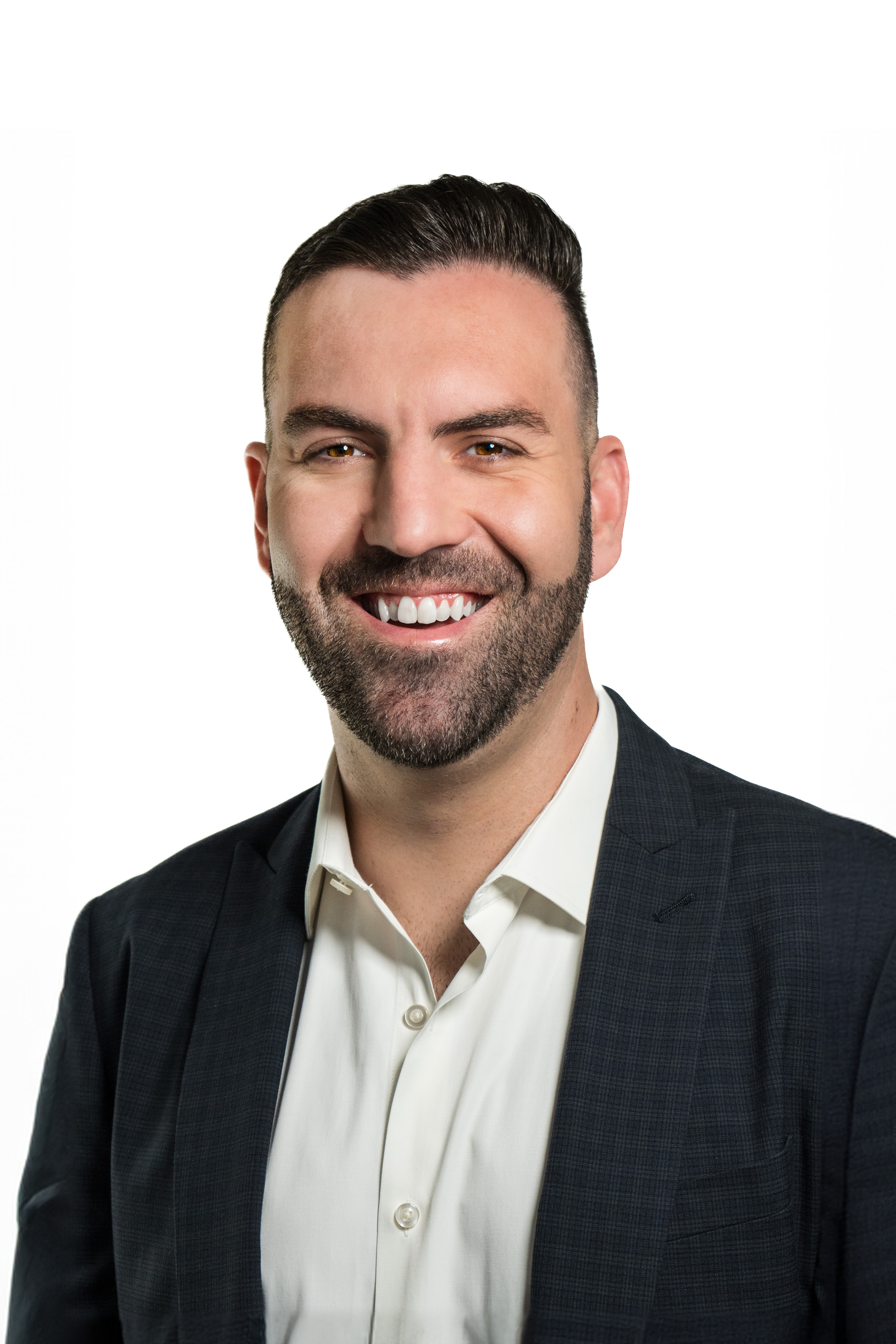 Devon Mills, Associate at Michelman & Robinson, LLP seen with a bright smile on his face